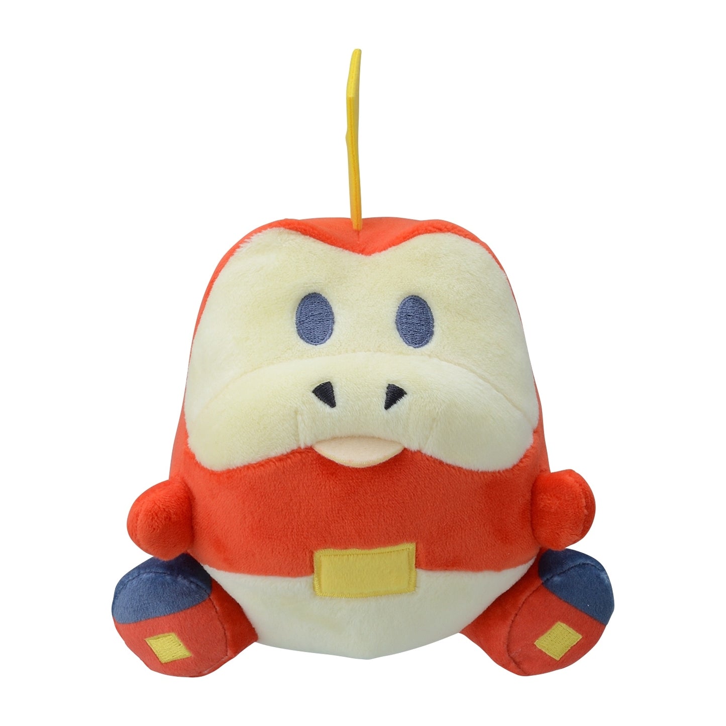 A chibi-style Fuecoco plush with a round body, cream face, red body, blue feet, and yellow flame-shaped crest on top of its head.